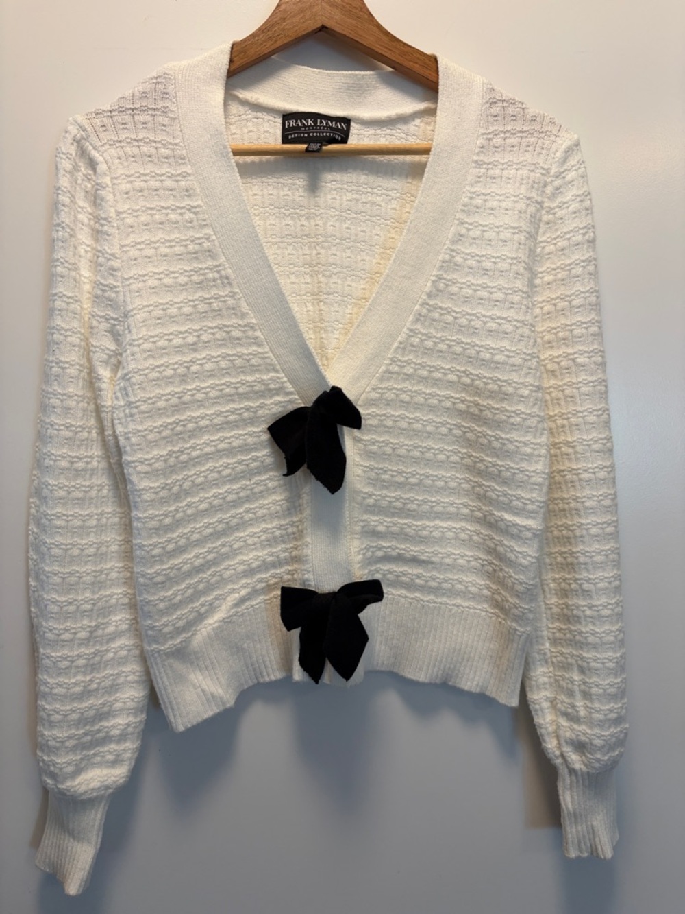 Frank Lyman Design Cream Knit Cardigan with Black Bow Accents
